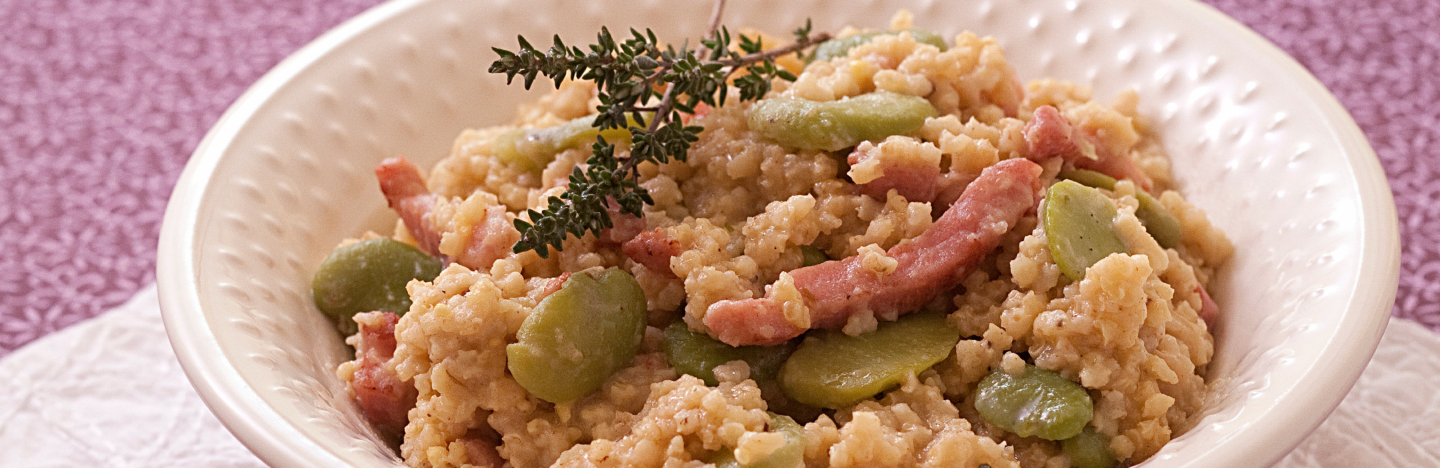 Risotto de millet aux lardons et fèves